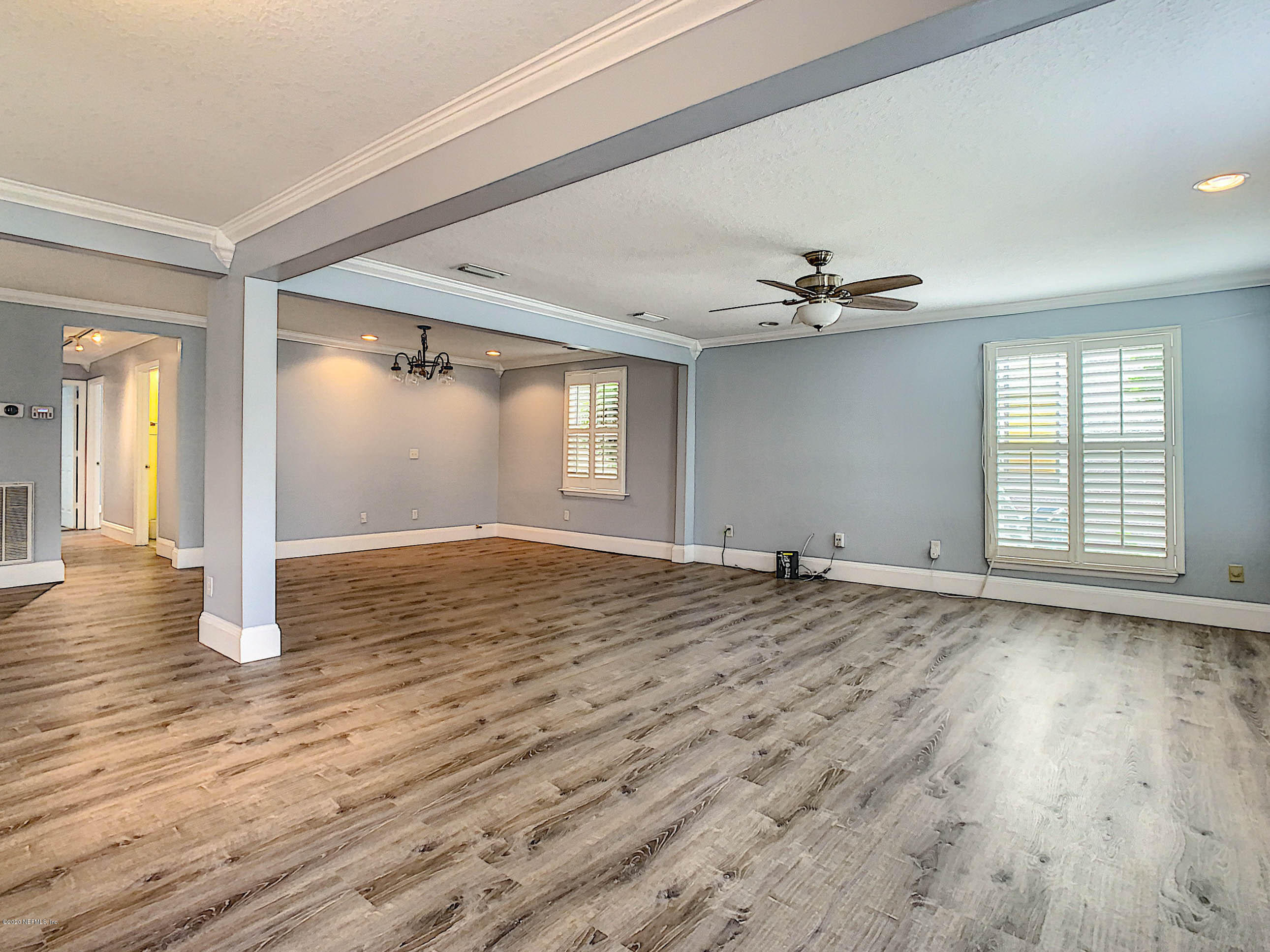 1609 First Street Neptune Beach, FL 32266 - Photo 3 of 30 wooden floor in an empty room with a window