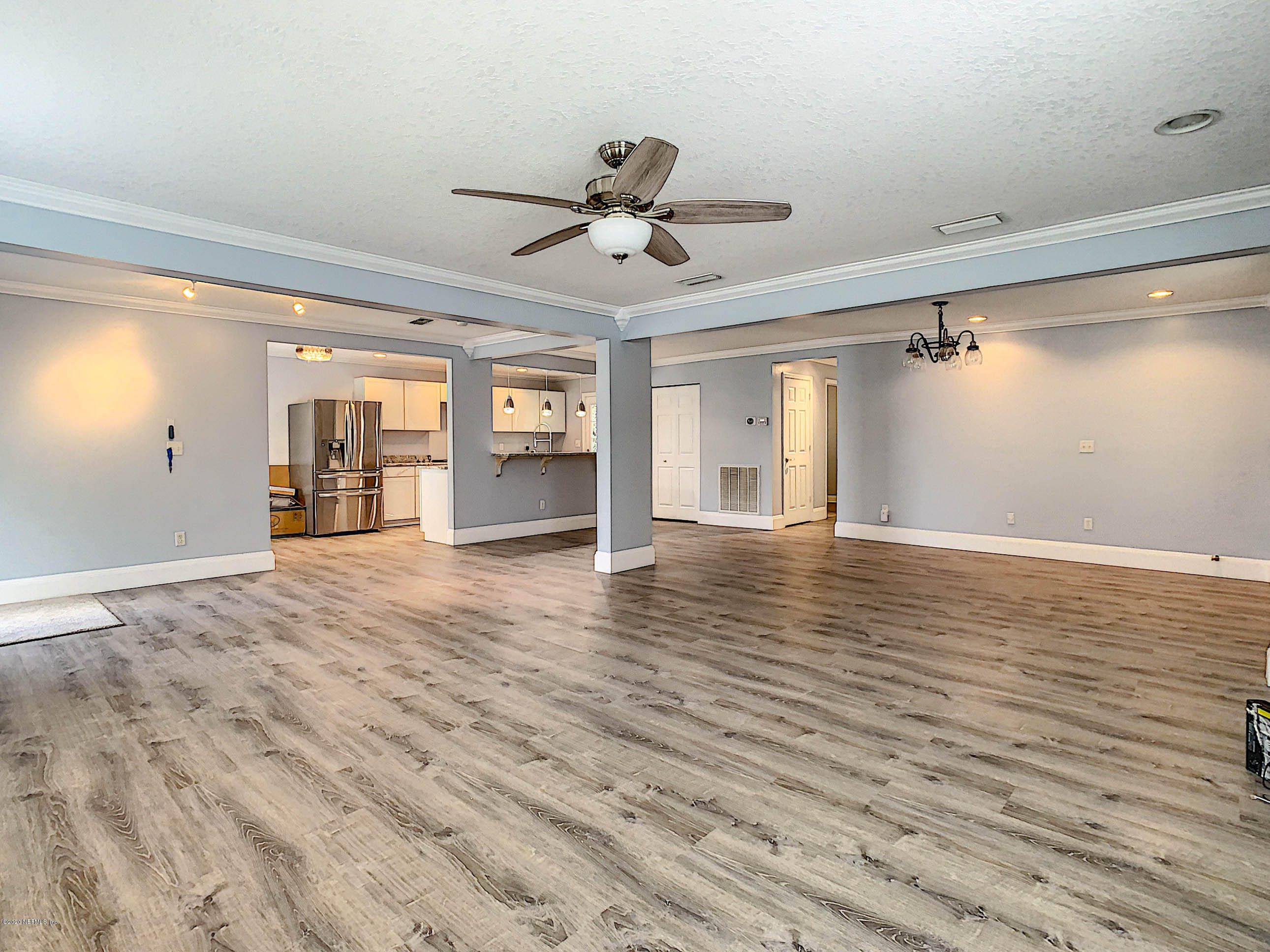 1609 First Street Neptune Beach, FL 32266 - Photo 5 of 30 wooden floor in an empty room with a window