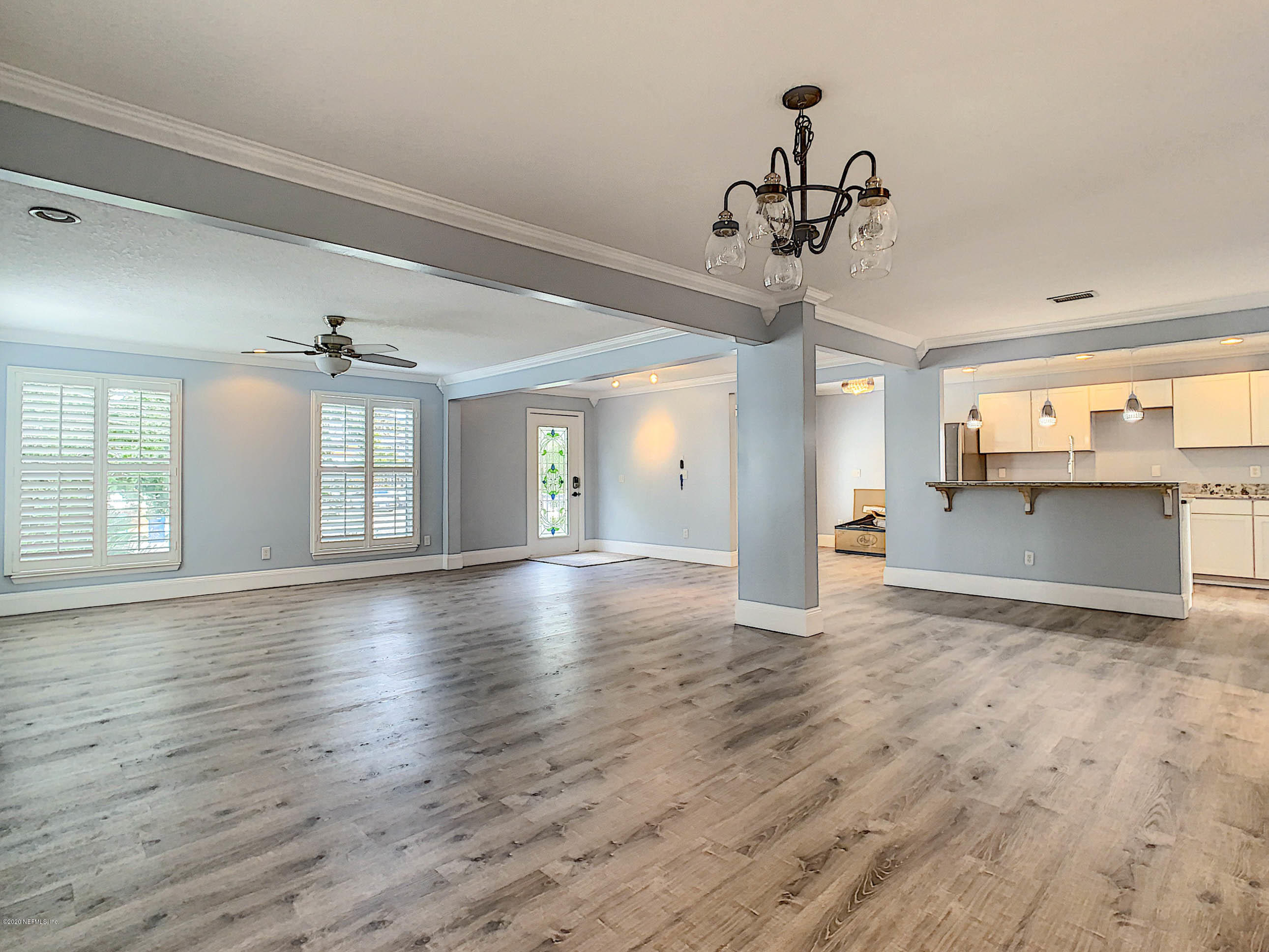 1609 First Street Neptune Beach, FL 32266 - Photo 10 of 30 a view of a room with wooden floor and windows