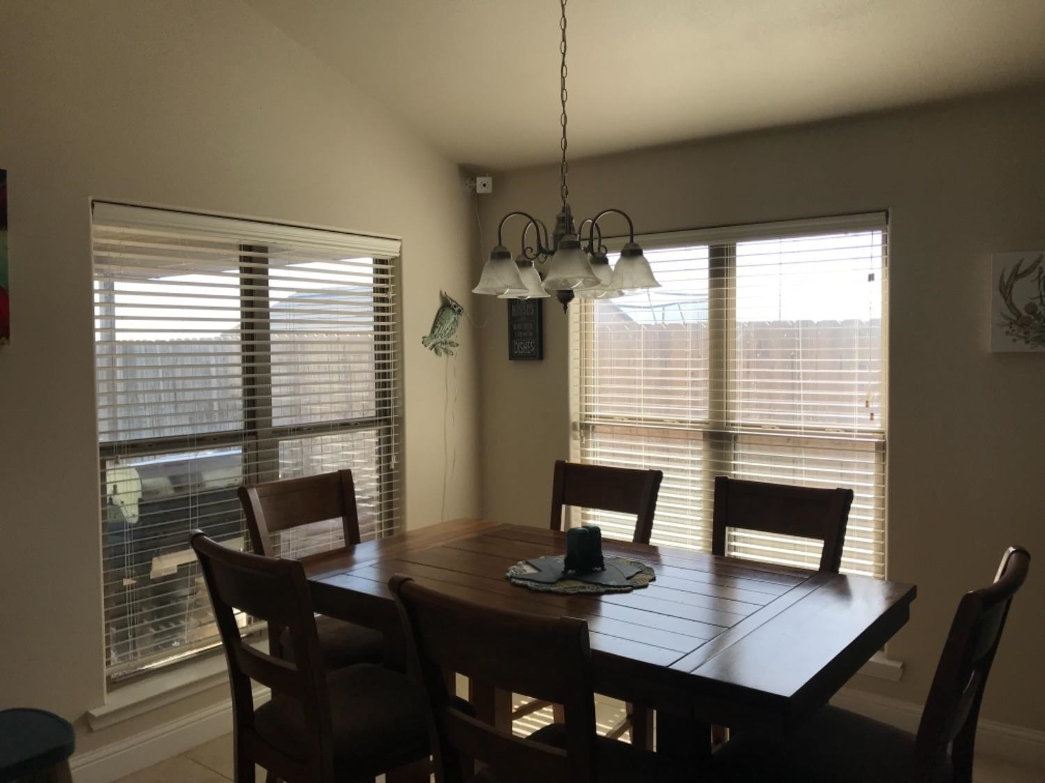 3643 Ridgely Avenue Lubbock, TX 79407 - Photo 8 of 10 a view of a dining room with furniture window and wooden floor
