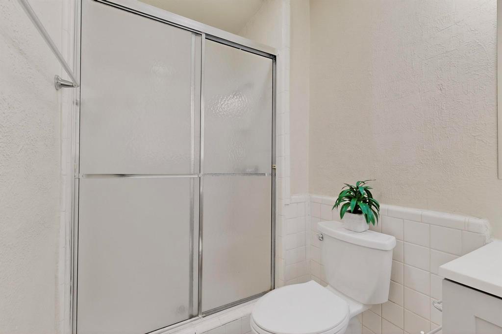 1538 Oakbrook Street Lancaster, TX 75134 - Photo 29 of 34 a white toilet sitting next to a shower