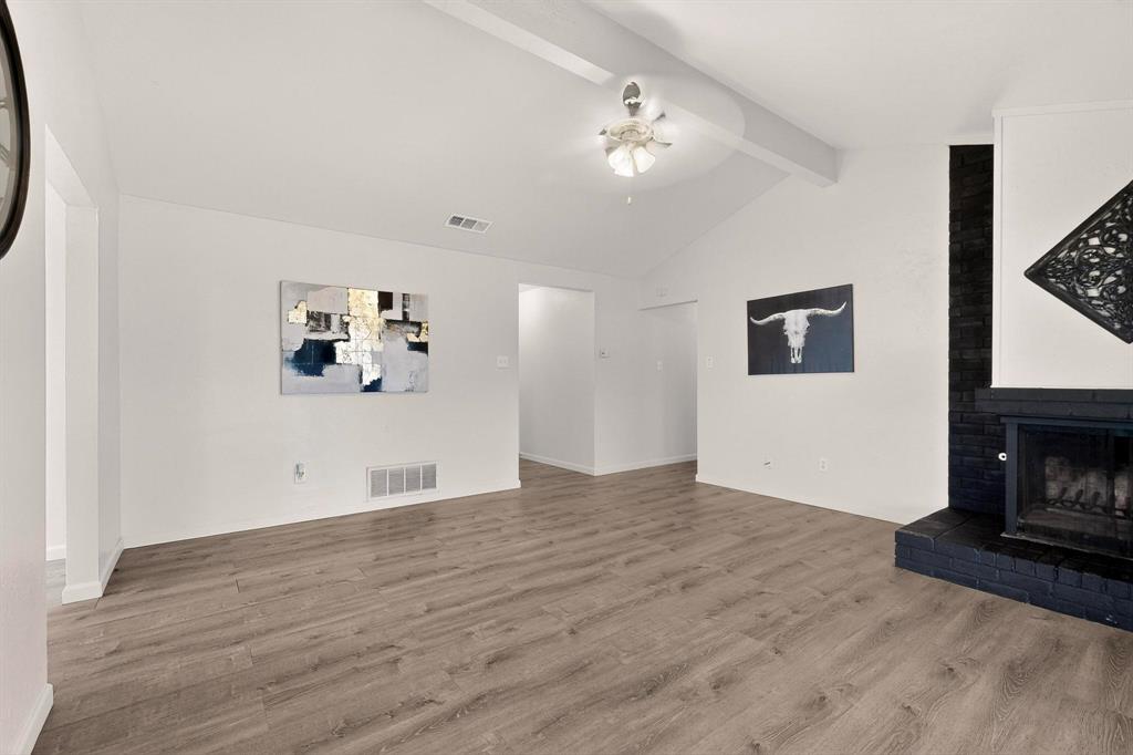 1538 Oakbrook Street Lancaster, TX 75134 - Photo 3 of 34 a view of empty room with wooden floor and fan
