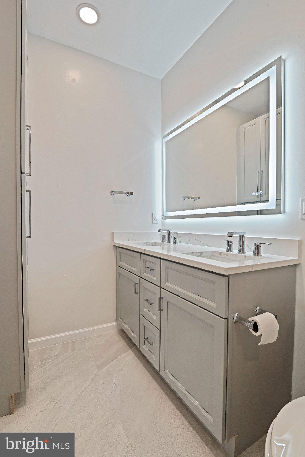 1519 North Point Drive, Unit 202 Reston, VA 20194 - Photo 34 of 49 Sleek modern bathroom with elegant finishes.