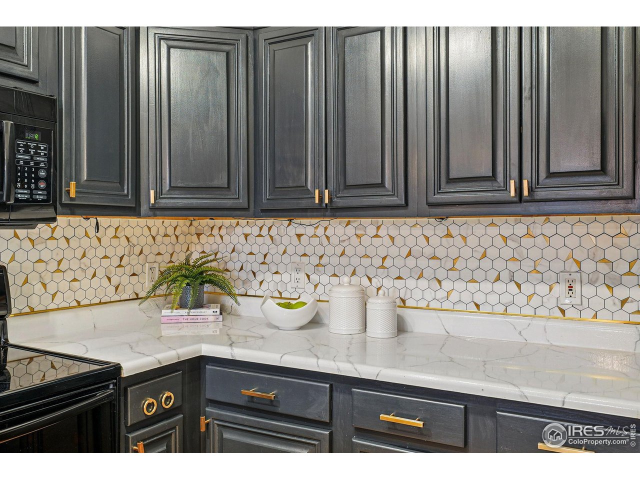 2700 Valmont Road, Unit 5 Boulder, CO 80304 - Photo 14 of 35 a kitchen with granite countertop a sink a stove and wooden cabinets