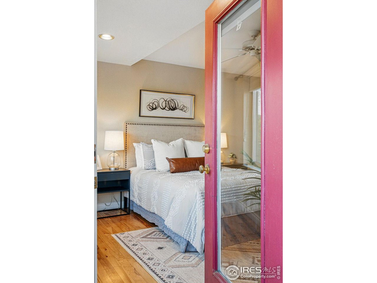 2700 Valmont Road, Unit 5 Boulder, CO 80304 - Photo 18 of 35 a bedroom with a bed and a bookshelf