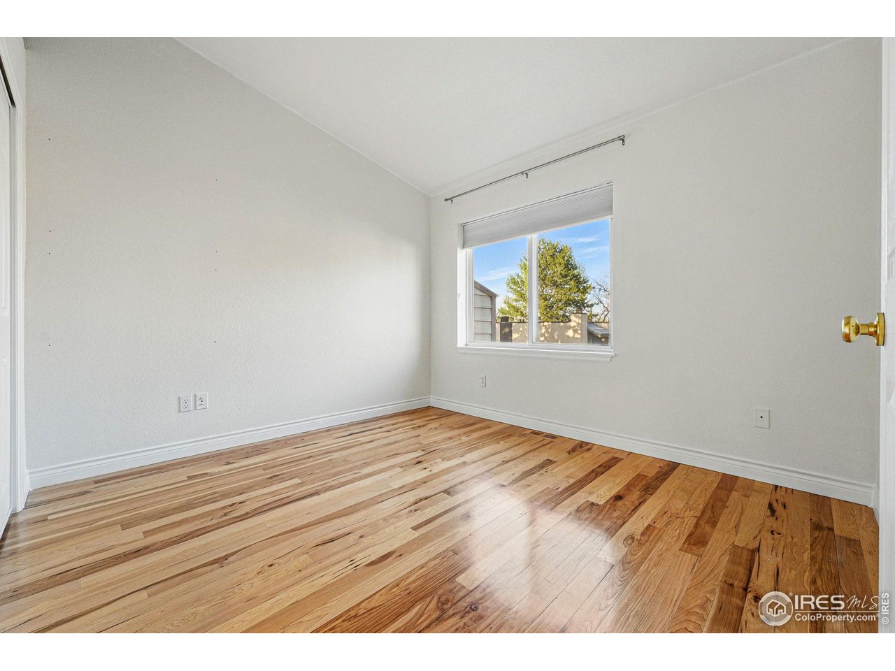 2700 Valmont Road, Unit 5 Boulder, CO 80304 - Photo 21 of 35 a view of empty room with wooden floor and fan