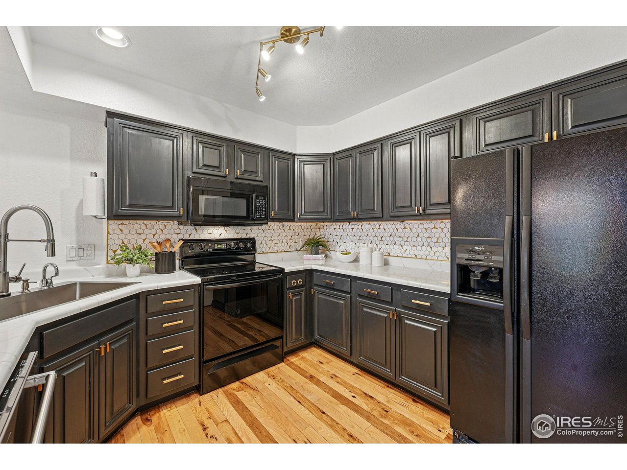 2700 Valmont Road, Unit 5 Boulder, CO 80304 - Photo 3 of 35 a kitchen with stainless steel appliances granite countertop a refrigerator stove and sink