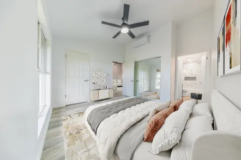 a bedroom with a bed and window