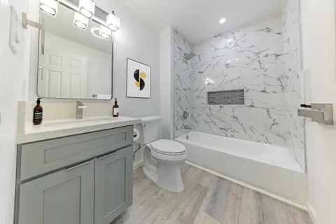 a bathroom with a sink a toilet and a bathtub