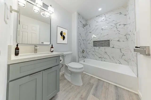 a bathroom with a sink a toilet and a bathtub