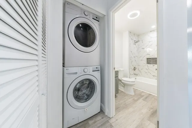a view of a bathroom with a washer and dryer