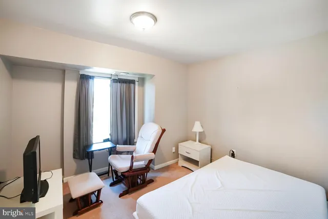 a bathroom with a toilet a sink and a mirror