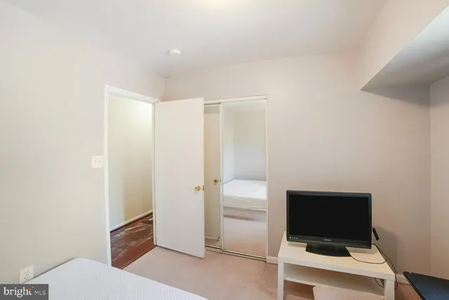 a bathroom with a sink mirror and toilet