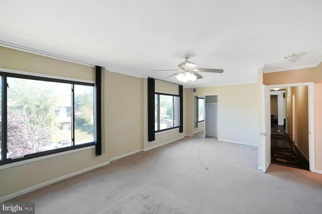 a view of an empty room with a window