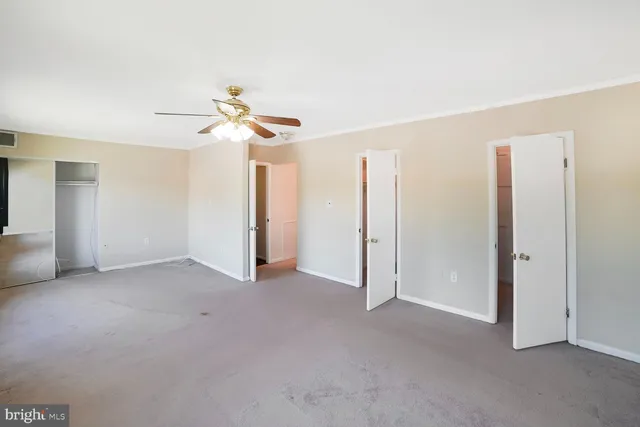 a bathroom with a toilet and a shower curtain