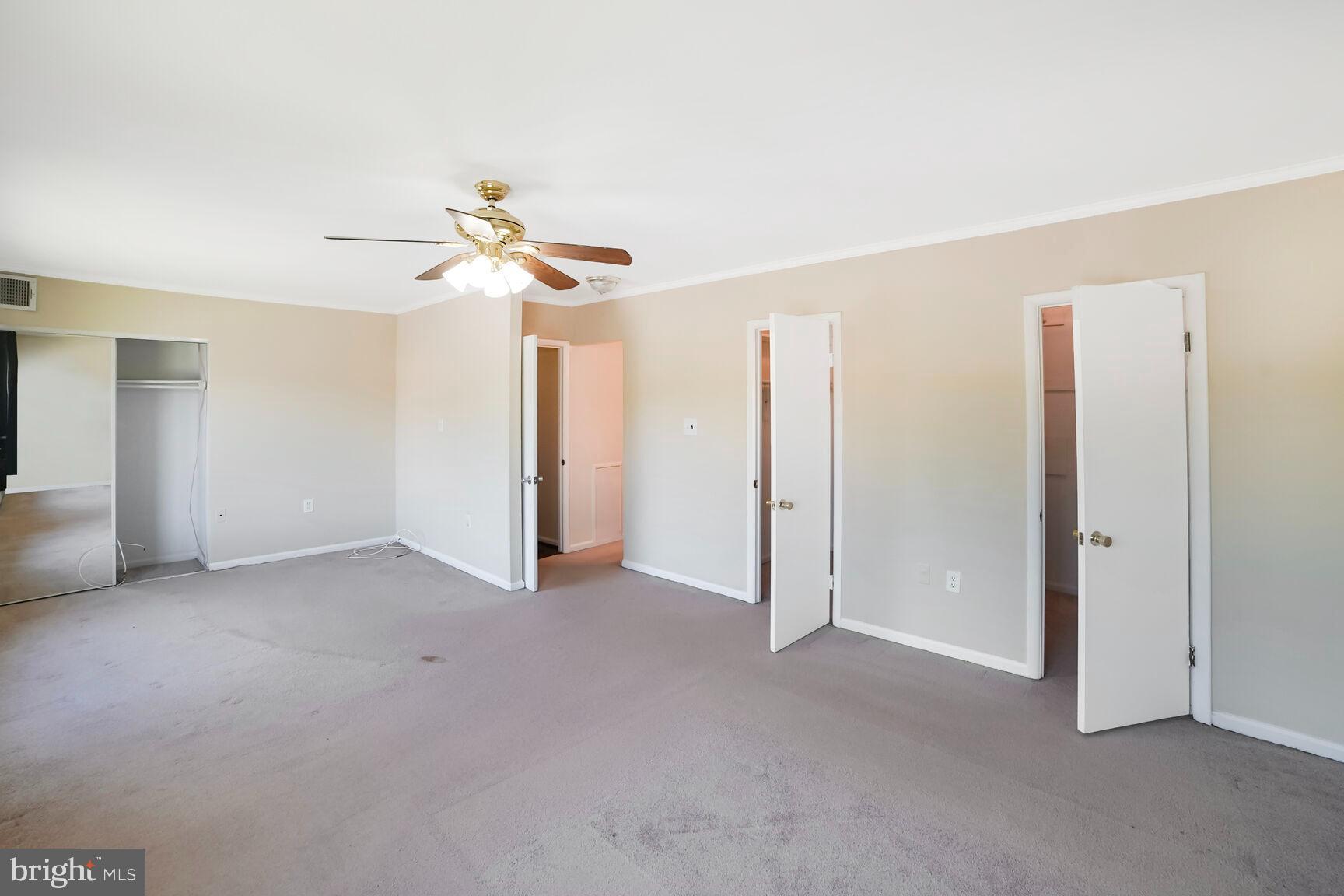 15708 Dorset Road, Unit 304 Laurel, MD 20707 - Photo 21 of 32 a view of a room with a ceiling fan and a window