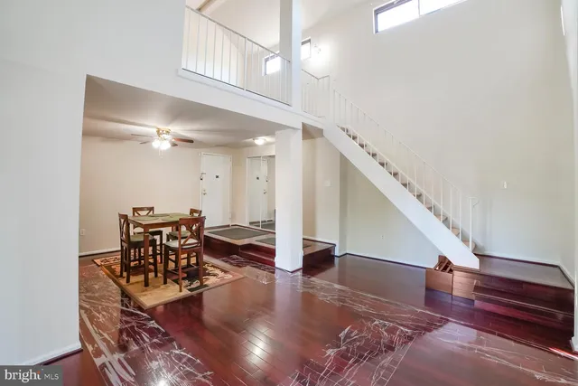 a view of dining room and hall with wooden floor