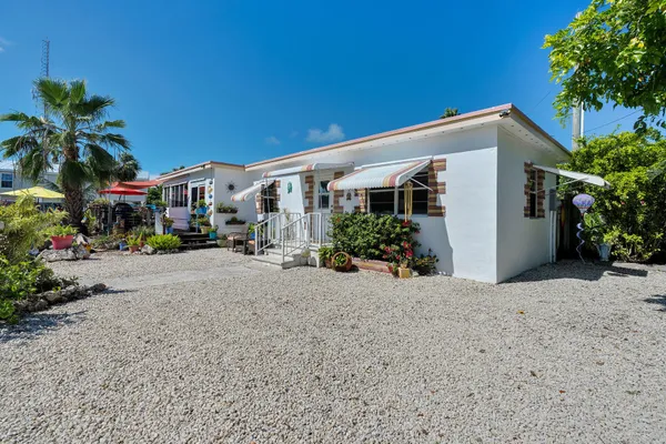 a view of a house with a street and a garage