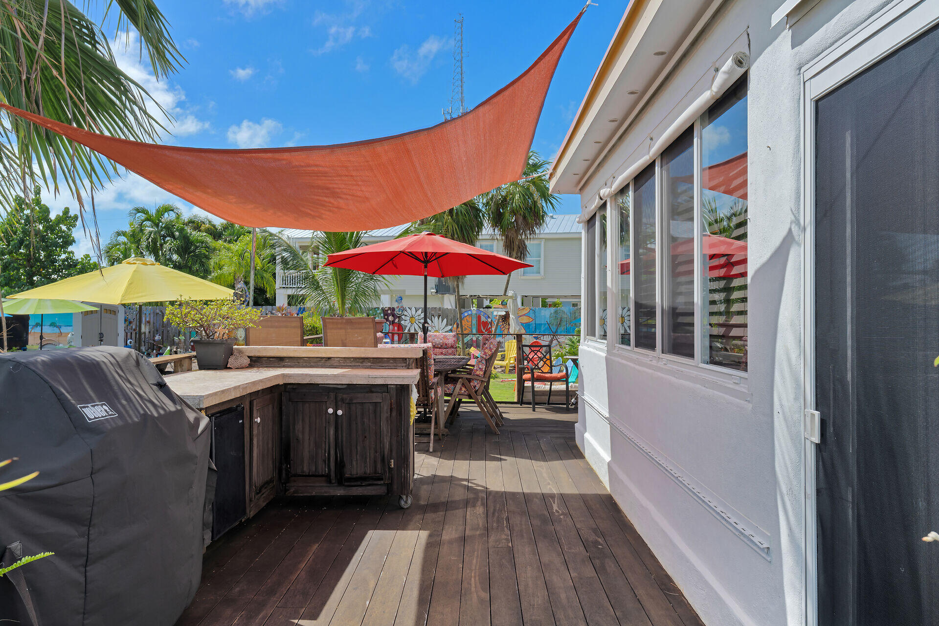 357 23rd Street Marathon, FL 33050 - Photo 18 of 48 a view of balcony with chairs and wooden floor