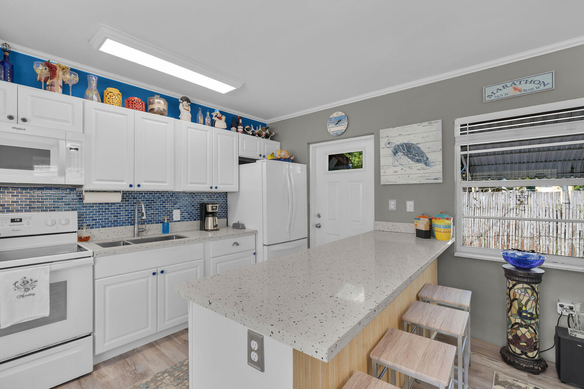 357 23rd Street Marathon, FL 33050 - Photo 22 of 48 a kitchen with stainless steel appliances granite countertop a sink and cabinets