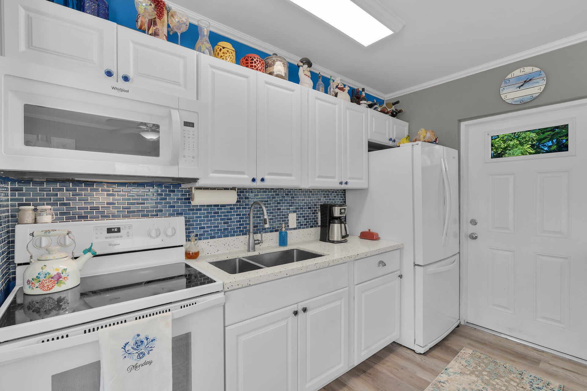 357 23rd Street Marathon, FL 33050 - Photo 23 of 48 a kitchen with white cabinets and white appliances