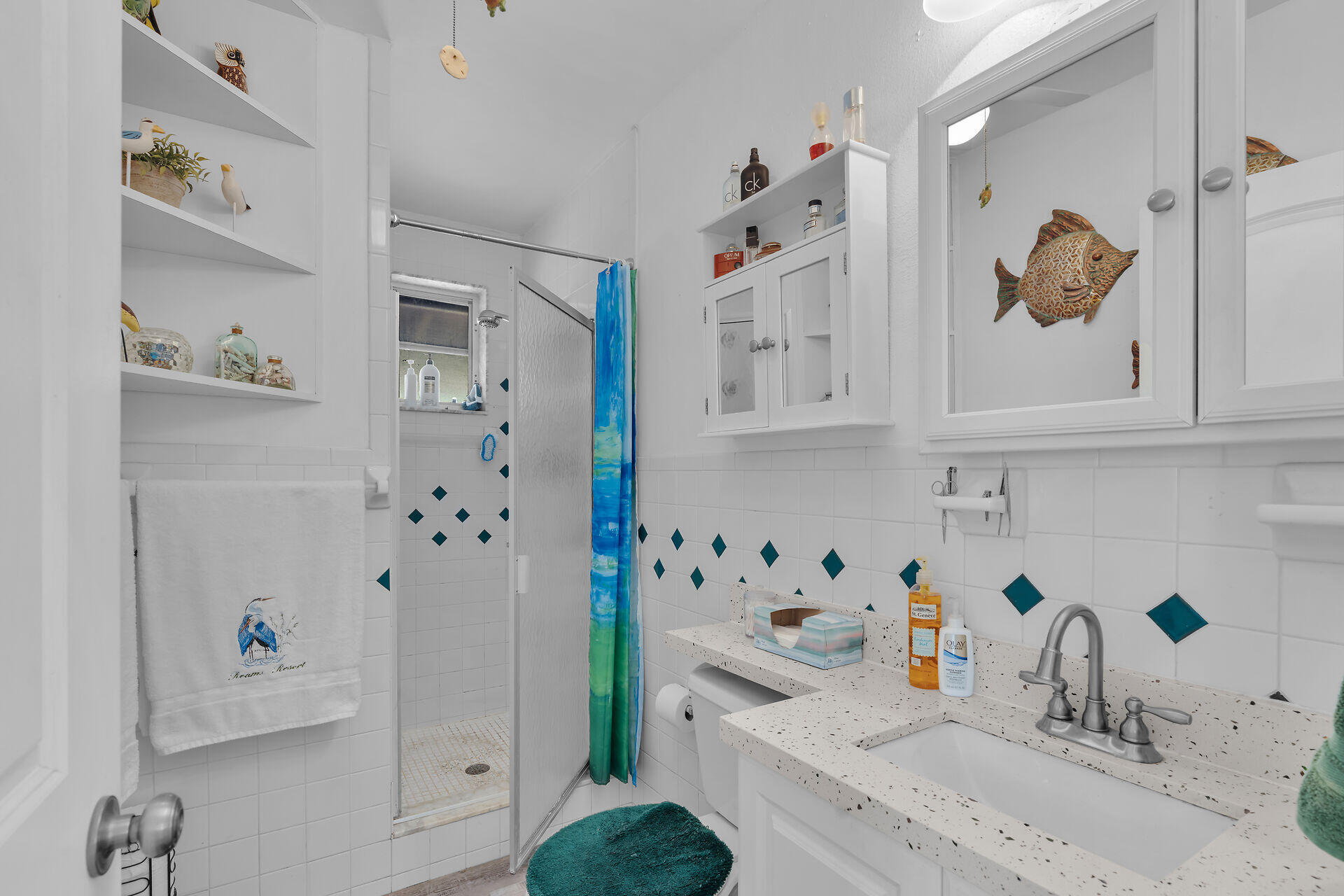 357 23rd Street Marathon, FL 33050 - Photo 27 of 48 a kitchen with stainless steel appliances a white refrigerator a sink and dishwasher with wooden floor