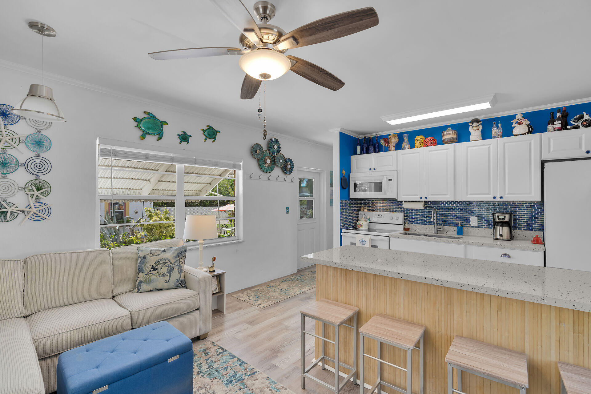 357 23rd Street Marathon, FL 33050 - Photo 4 of 48 a living room with stainless steel appliances granite countertop furniture a couch and a chandelier