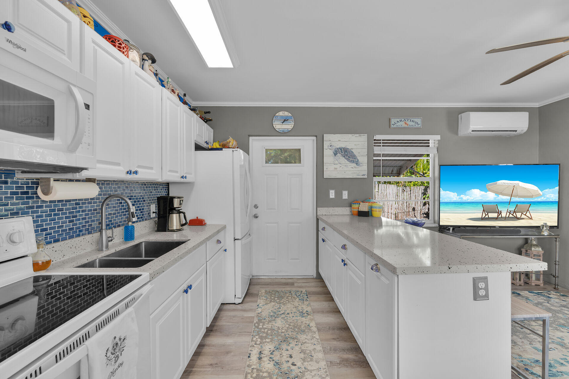 357 23rd Street Marathon, FL 33050 - Photo 8 of 48 a kitchen with stainless steel appliances granite countertop a sink and stove