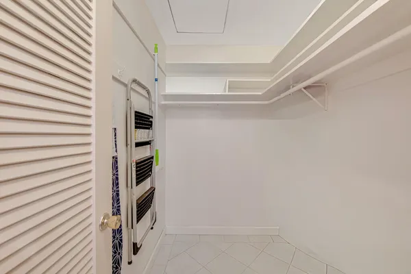 a bedroom with bed and window