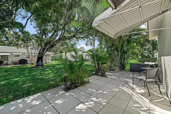 a view of house with backyard