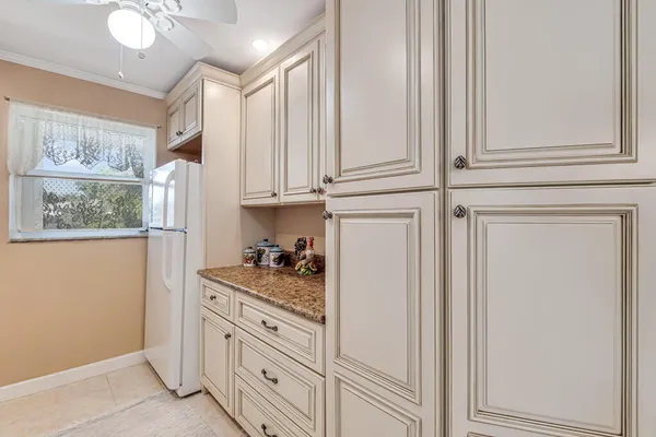 a kitchen with cabinets and appliances