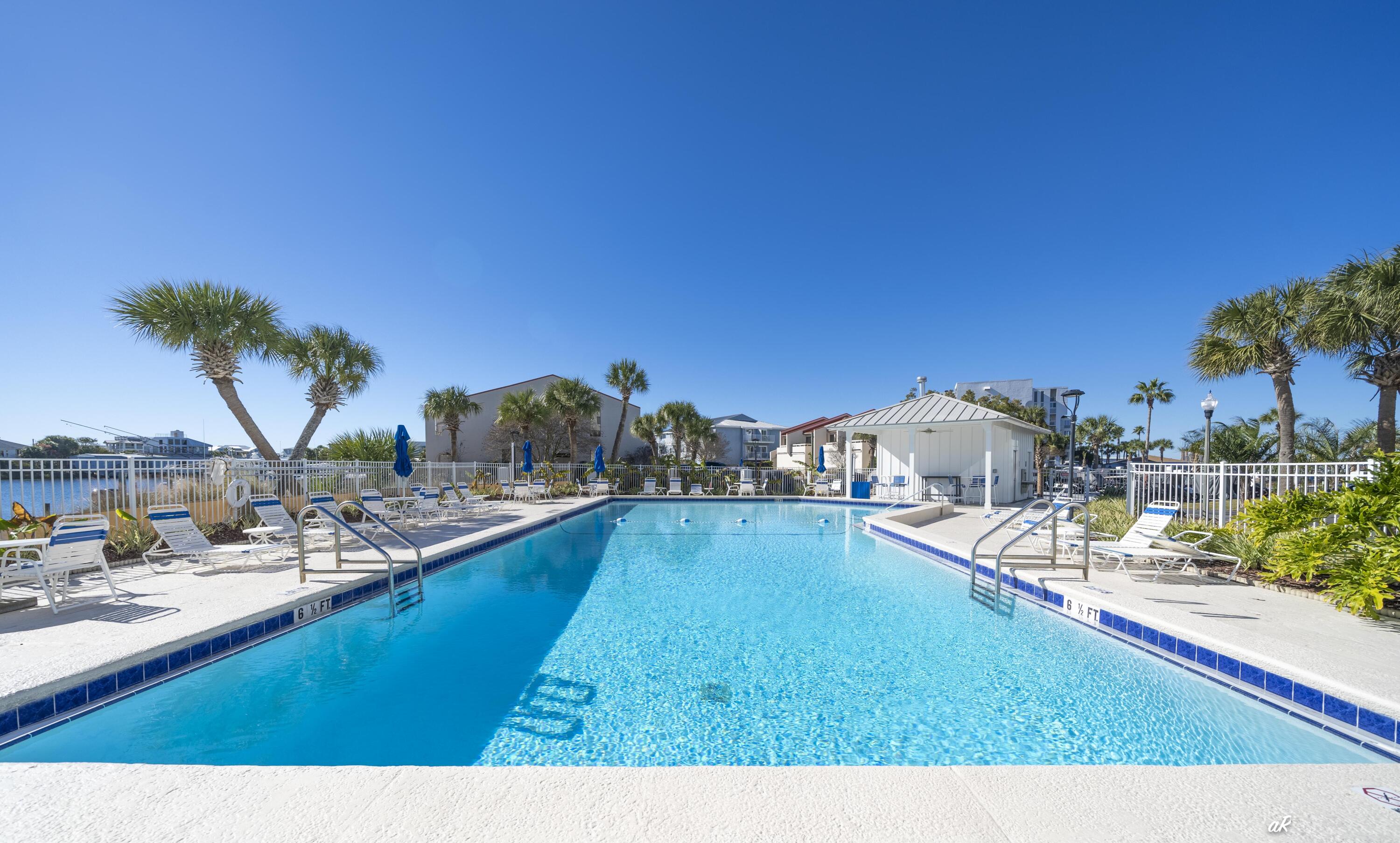 30 Moreno Point Road, Unit 404A Destin, FL 32541 - Photo 45 of 52 a view of a house with outdoor space and swimming pool