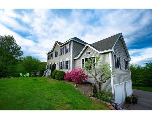 437 Ashby Road Ashburnham, MA 01430 - Photo 1 of 30 a front view of a house with garden