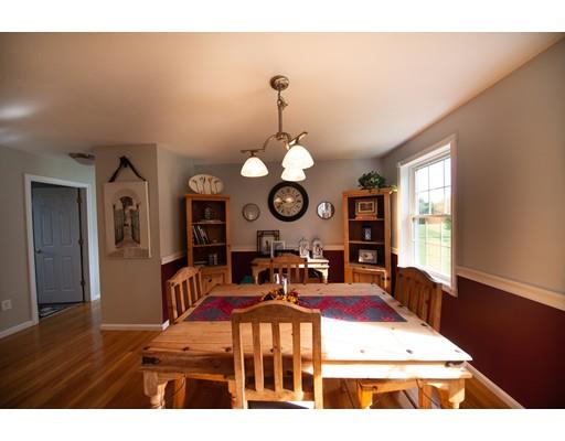 437 Ashby Road Ashburnham, MA 01430 - Photo 11 of 30 a living room with furniture a chandelier and a dining table