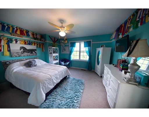 437 Ashby Road Ashburnham, MA 01430 - Photo 19 of 30 a bedroom with a bed and a large mirror on the dresser