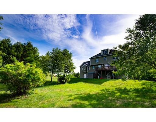 437 Ashby Road Ashburnham, MA 01430 - Photo 28 of 30 a black and white house with a yard