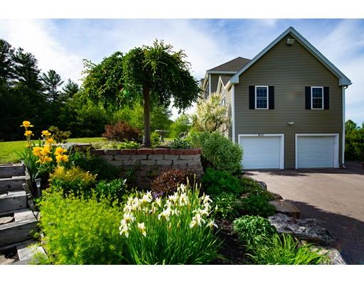 437 Ashby Road Ashburnham, MA 01430 - Photo 3 of 30 a view of a house with a yard and potted plants