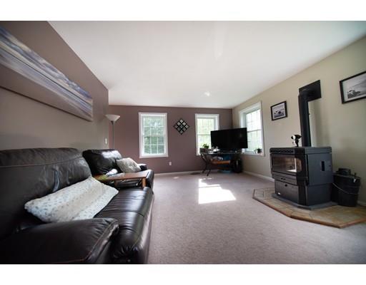 437 Ashby Road Ashburnham, MA 01430 - Photo 5 of 30 a living room with furniture and a flat screen tv