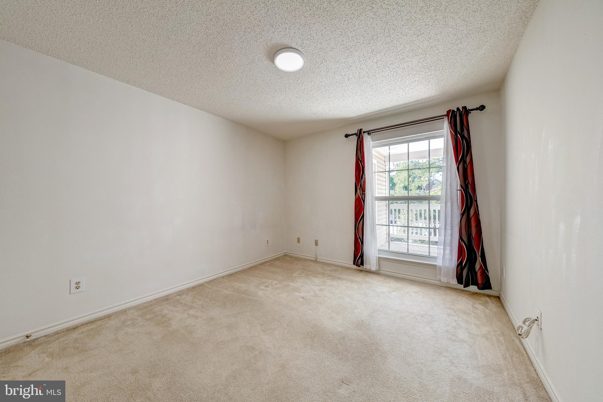 1539 Lincoln Way, Unit 302B McLean, VA 22102 - Photo 19 of 53 a view of an empty room with a window