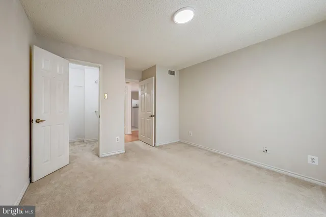 a bathroom with a sink a toilet a mirror a bathtub and shower