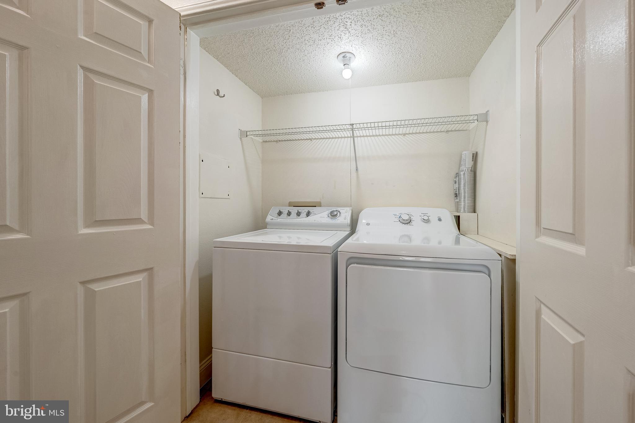1539 Lincoln Way, Unit 302B McLean, VA 22102 - Photo 29 of 53 a utility room with dryer and washer
