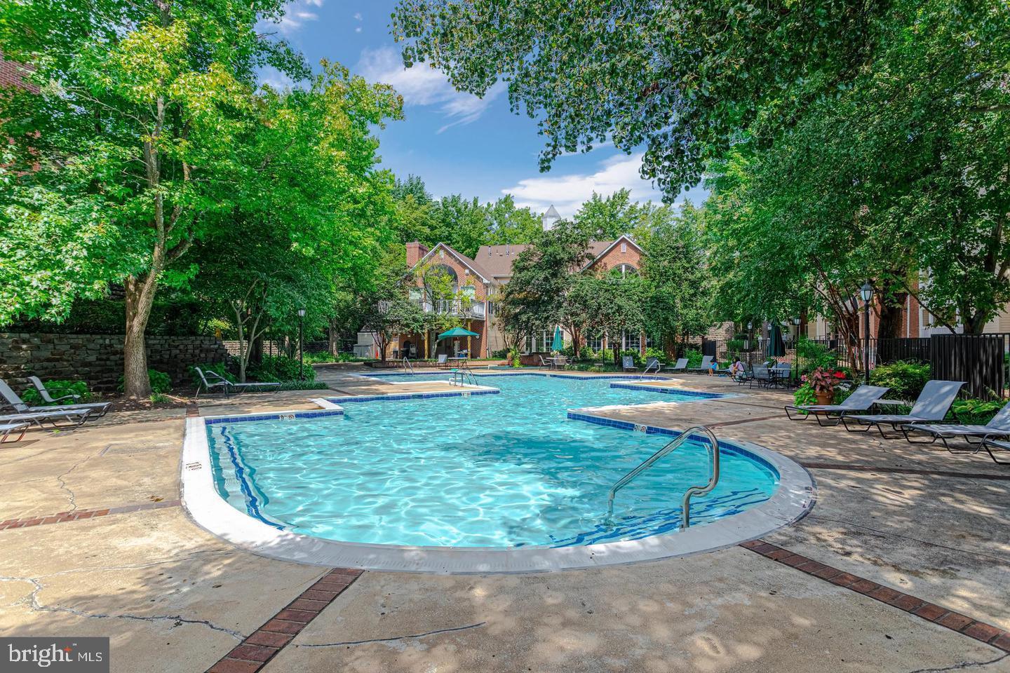 1539 Lincoln Way, Unit 302B McLean, VA 22102 - Photo 45 of 53 a view of a swimming pool with a sitting space