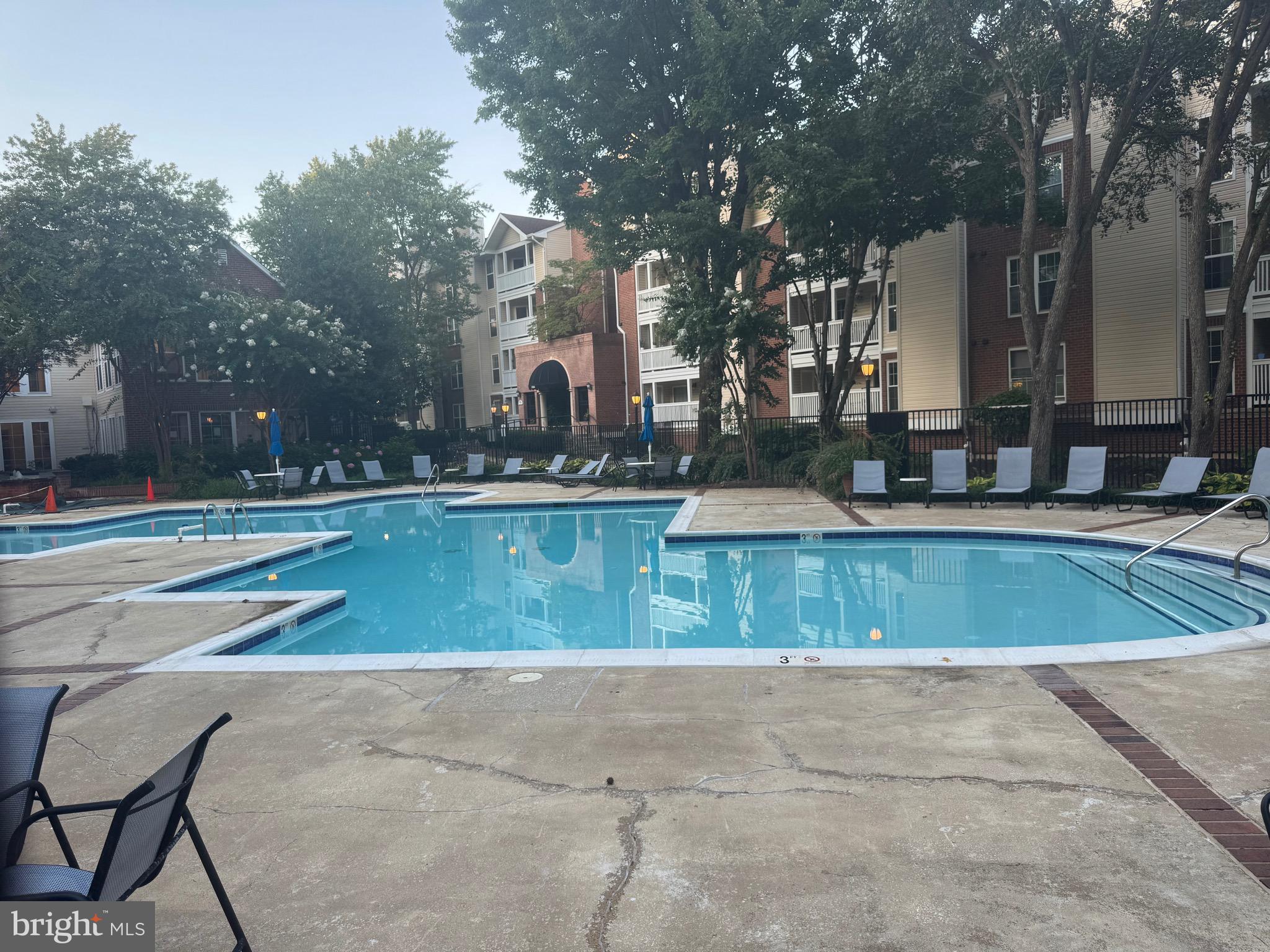 1539 Lincoln Way, Unit 302B McLean, VA 22102 - Photo 46 of 53 a view of a swimming pool with a yard
