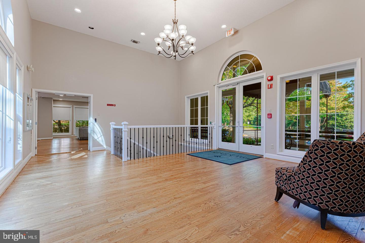 1539 Lincoln Way, Unit 302B McLean, VA 22102 - Photo 50 of 53 a view of a bedroom with wooden floor and balcony
