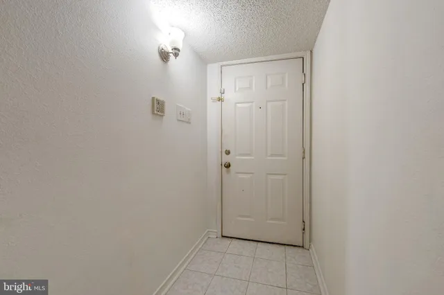 an empty room with a hallway