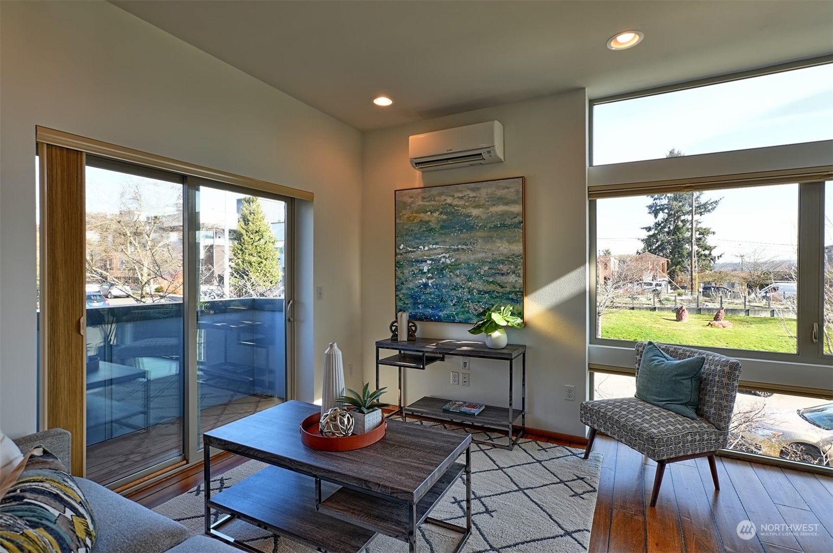 4453 Renton Avenue South Seattle, WA 98108 - Photo 11 of 25 a living room with furniture and a floor to ceiling window