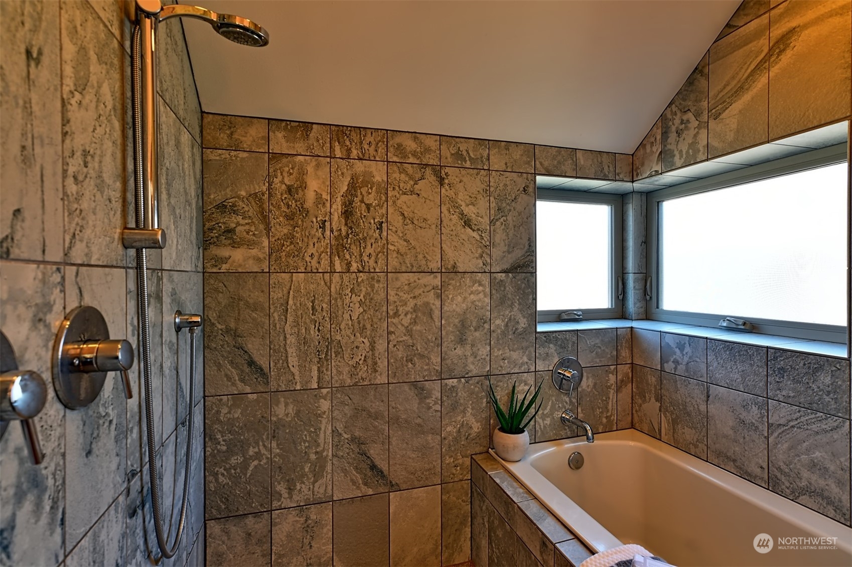 4453 Renton Avenue South Seattle, WA 98108 - Photo 18 of 25 a bathroom with a bathtub and window