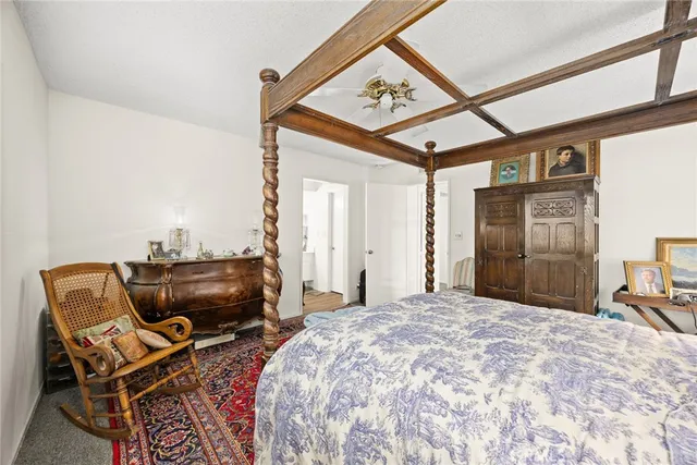 a bedroom with furniture and a bed