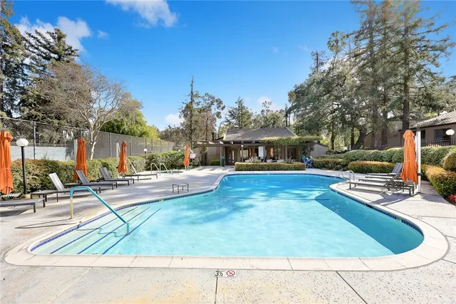 a view of a swimming pool with a patio