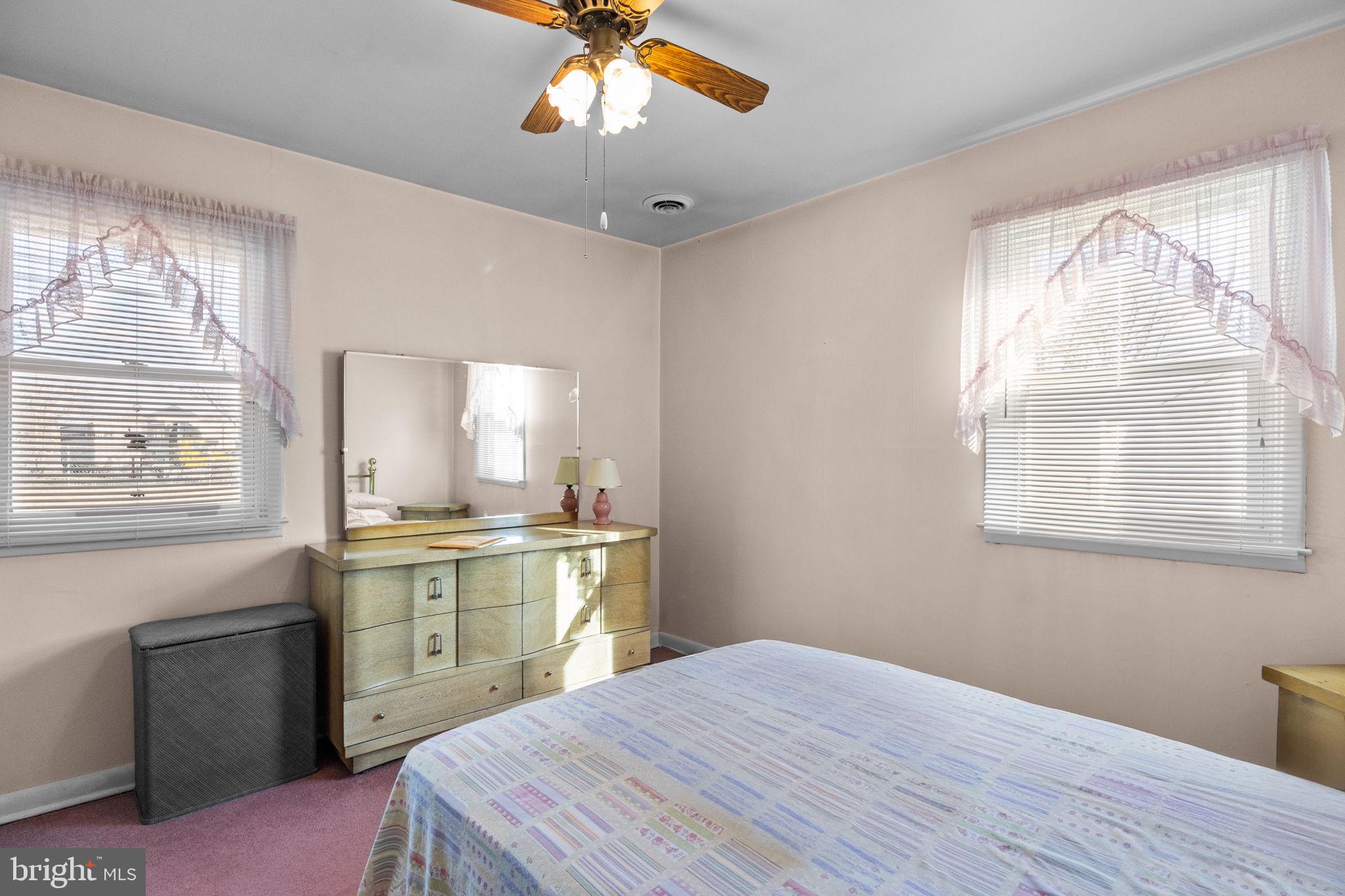 3731 Dresher Road Bensalem, PA 19020 - Photo 12 of 21 a bedroom with a bed and a chandelier